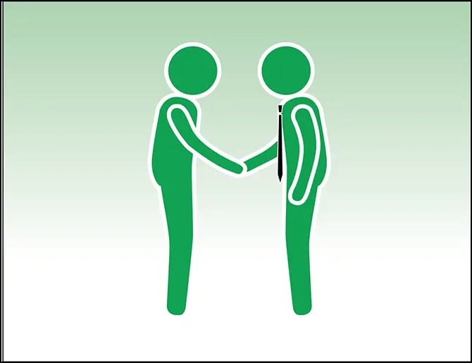 real estate agent shaking hands with an event participant