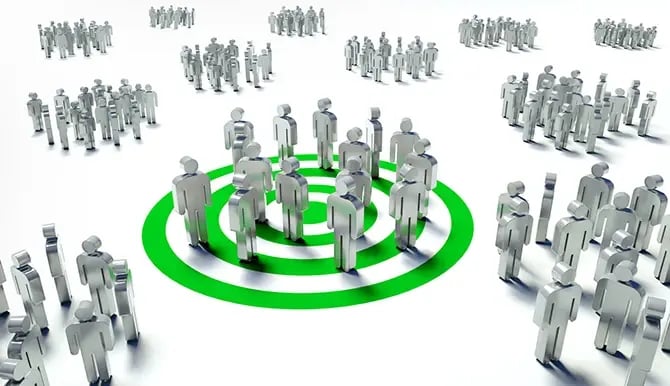 Marketing illustration of a target group with human figures on top of a green bullseye.