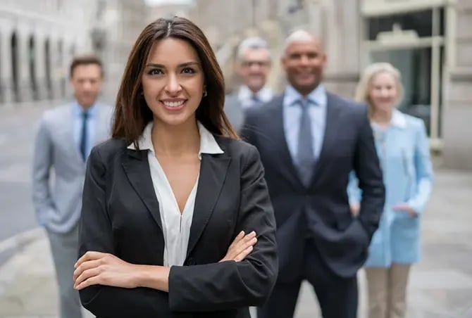 An independent agent with other insurance professionals blurred in the background.