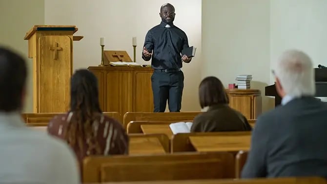 young African American pastor giving sermon